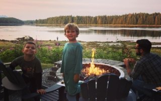 Photo of a Family Around a Campfire at Favorite Bay, One of the Best Alaska Fishing Resorts