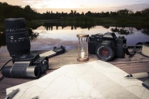 A first person view of cameras and other accessories associated with planning the upcoming Alaska fishing season.