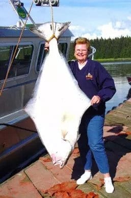 Woman with large fish.