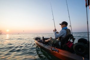 An avid angler tries his hand at kayak fishing at Favorite Bay Lodge.